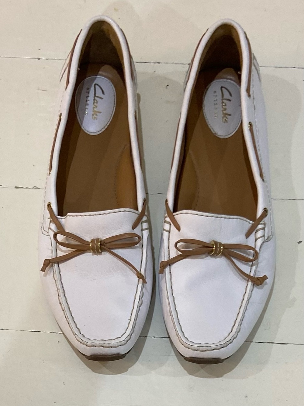 Clarks Women’s White Leather Loafers with Tan Bow Accents